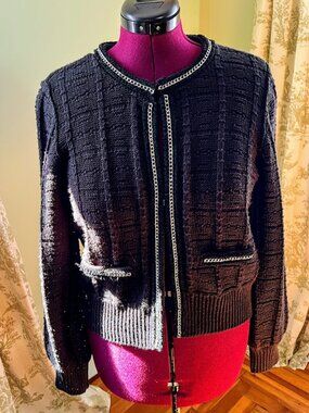 Black Chanel-style knit cardigan with silver details